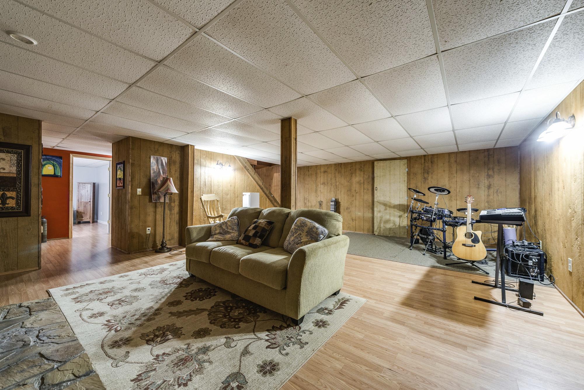 7451 Martin Road Baxter, TN 38544 - Photo 24 of 29 a living room with furniture and wooden floor