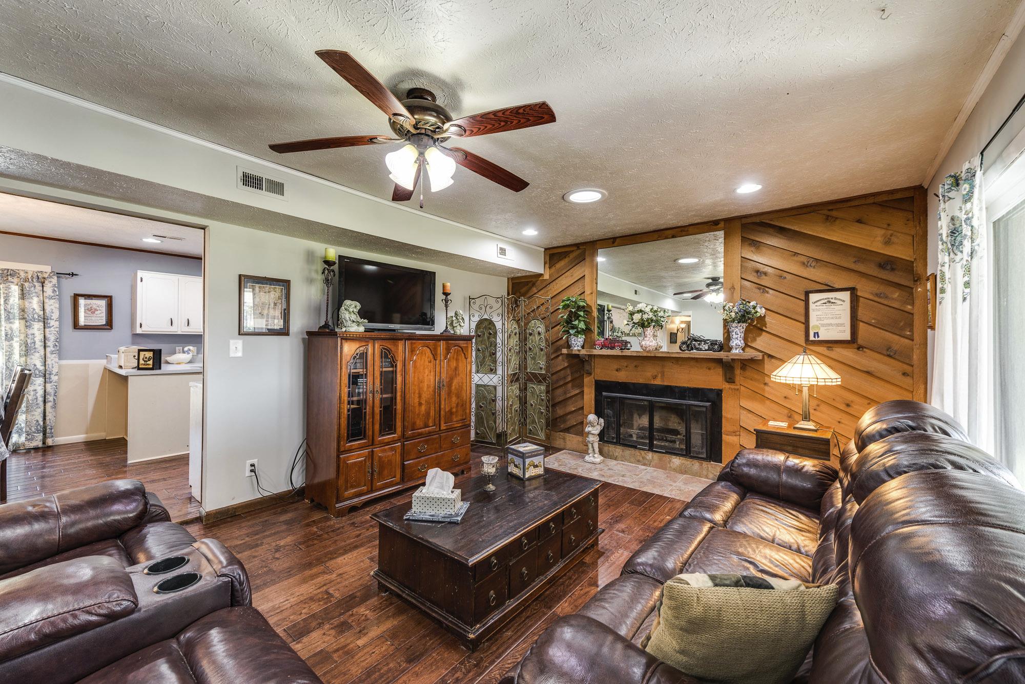 7451 Martin Road Baxter, TN 38544 - Photo 9 of 29 a living room with furniture and a fireplace