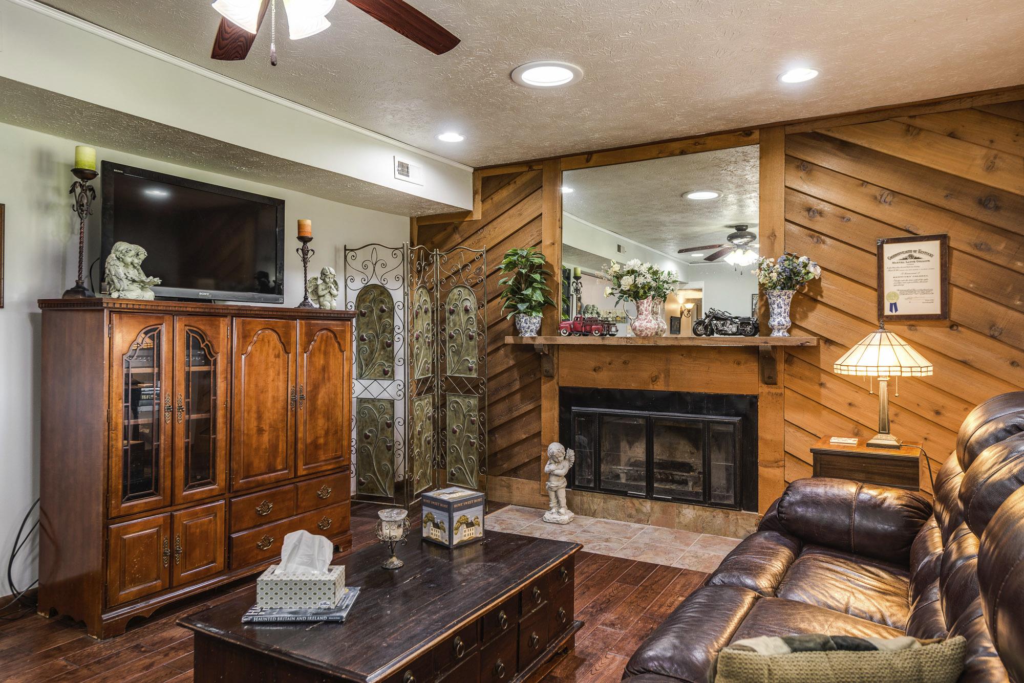 7451 Martin Road Baxter, TN 38544 - Photo 10 of 29 a living room with furniture and a fireplace