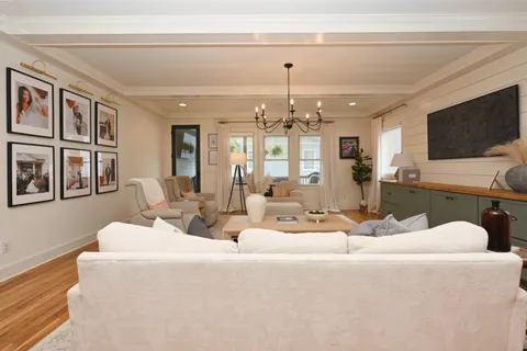 a bathroom with a sink mirror and toilet