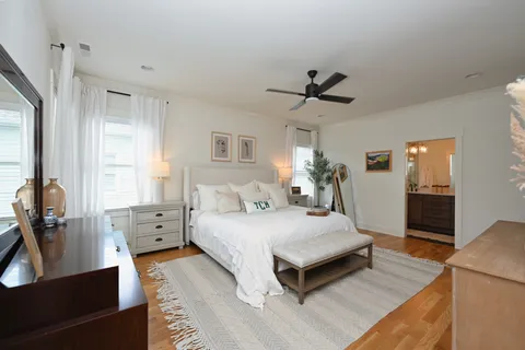 a bathroom with a double vanity sink mirror and shower