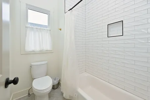 a bathroom with a double vanity sink mirror and double