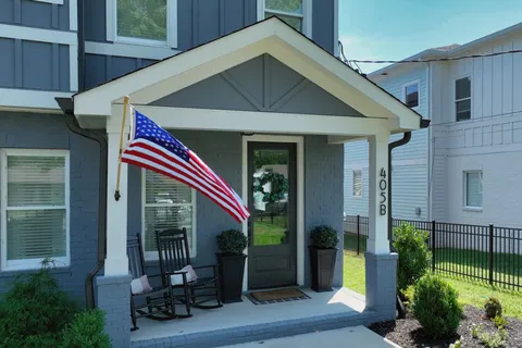 an aerial view of a house with backyard