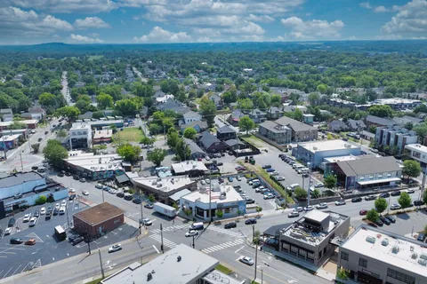 a view of building with outdoor space and swimming pool