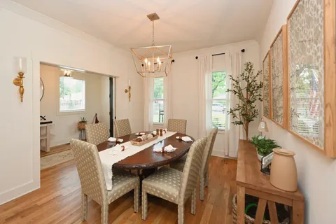 a large kitchen with a table and chairs