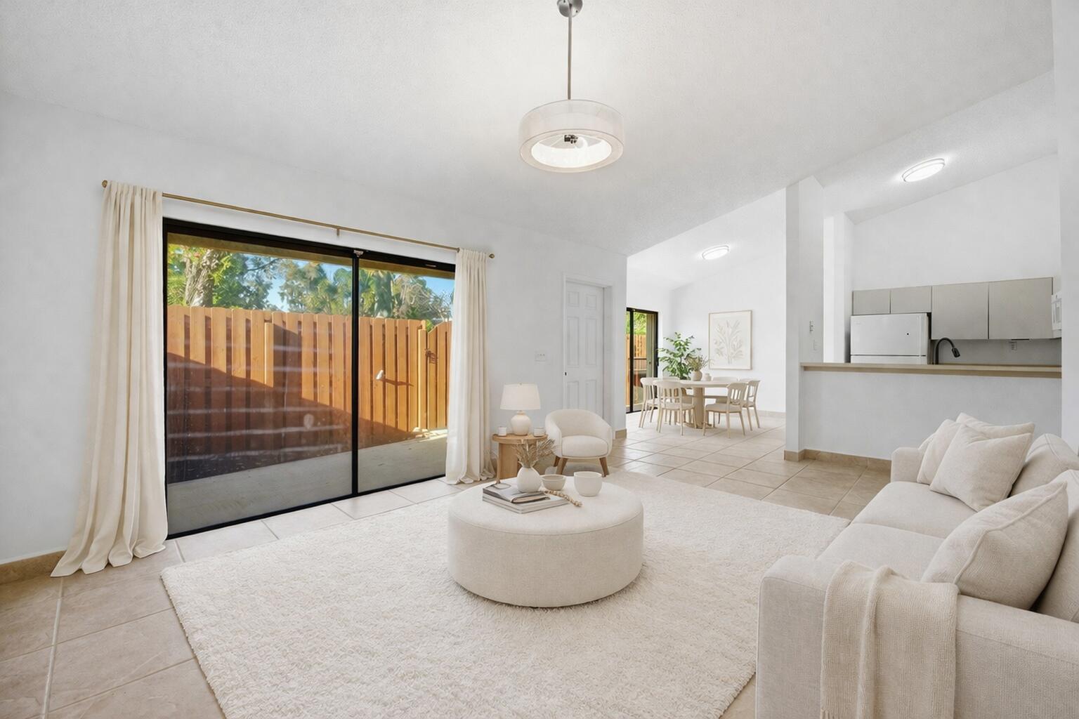 131 Springdale Circle Palm Springs, FL 33461 - Photo 3 of 19 a living room with furniture and a large window