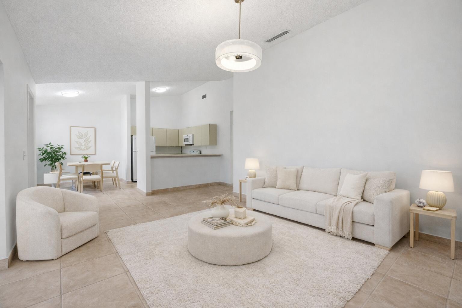 131 Springdale Circle Palm Springs, FL 33461 - Photo 4 of 19 a living room with furniture and kitchen view