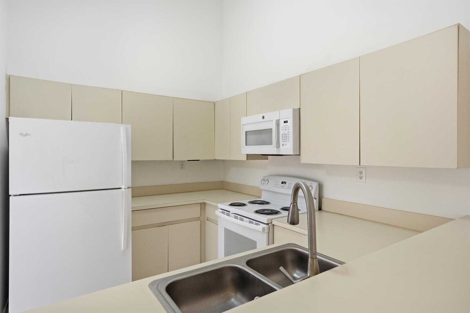 131 Springdale Circle Palm Springs, FL 33461 - Photo 7 of 19 a kitchen with a sink a stove and refrigerator