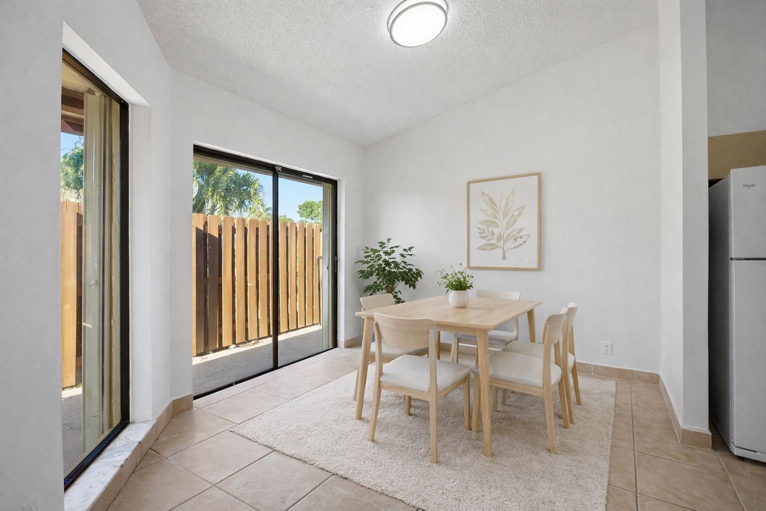 131 Springdale Circle Palm Springs, FL 33461 - Photo 9 of 19 a dining room with furniture and window