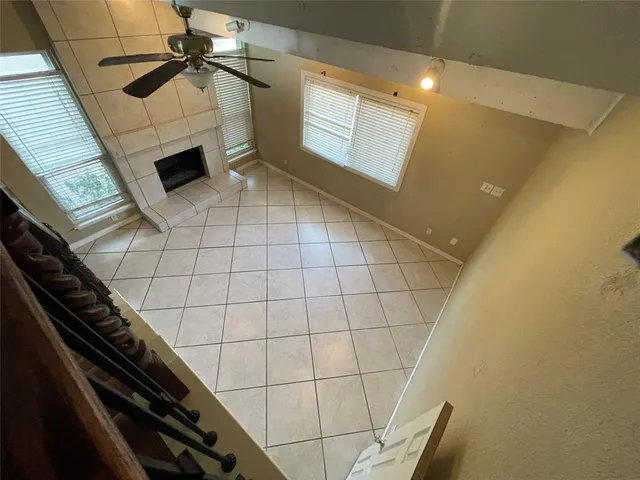 a view of a livingroom with furniture and staircase