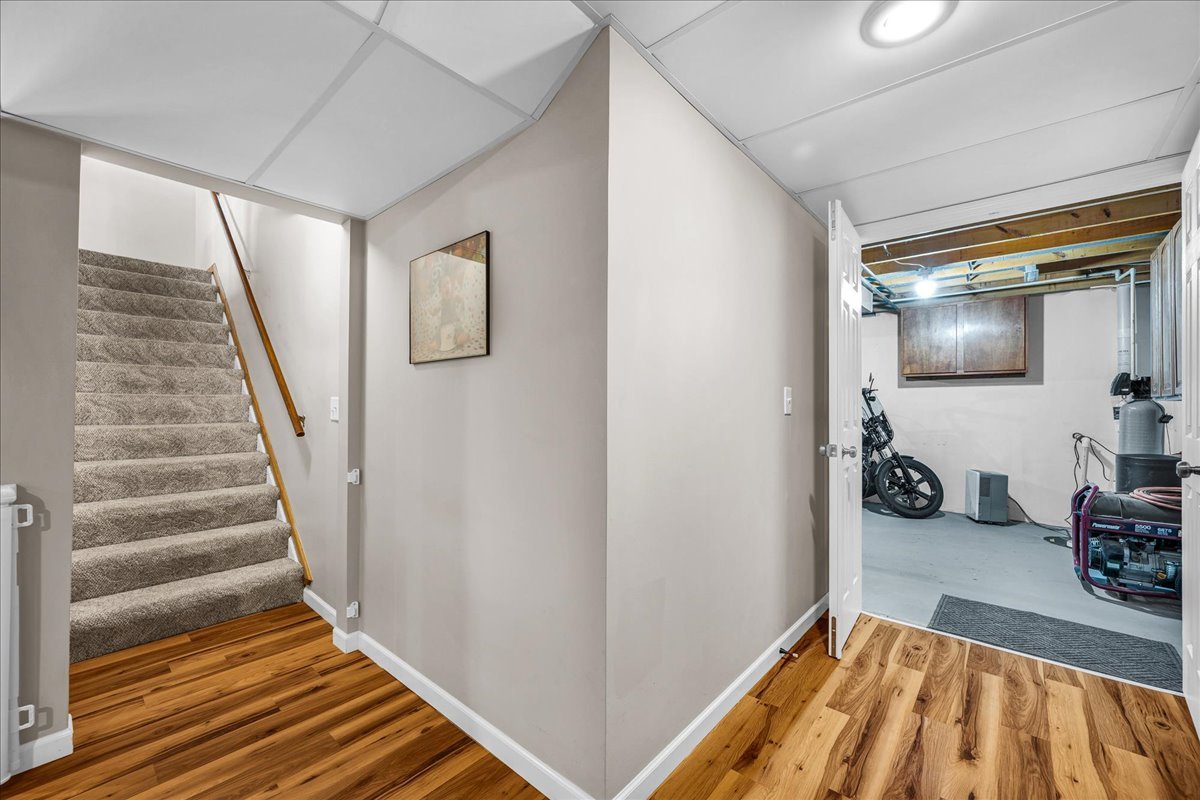 505 West North Street Danvers, IL 61732 - Photo 28 of 45 a view of a livingroom with wooden floor and stairs