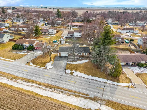 an aerial view of residential houses with outdoor space