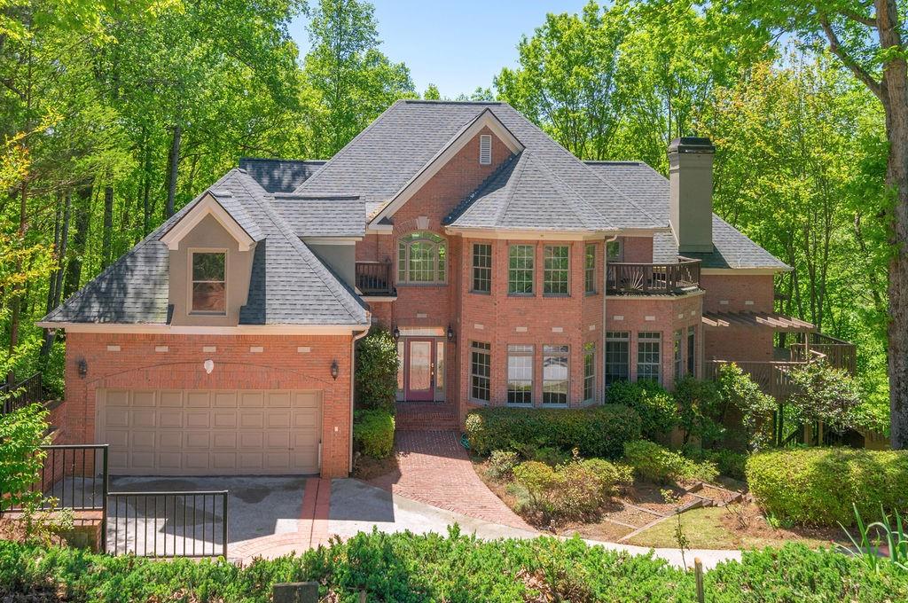 27 Wing Mill Road Sandy Springs, GA 30350 - Photo 1 of 1 a front view of a house with a yard