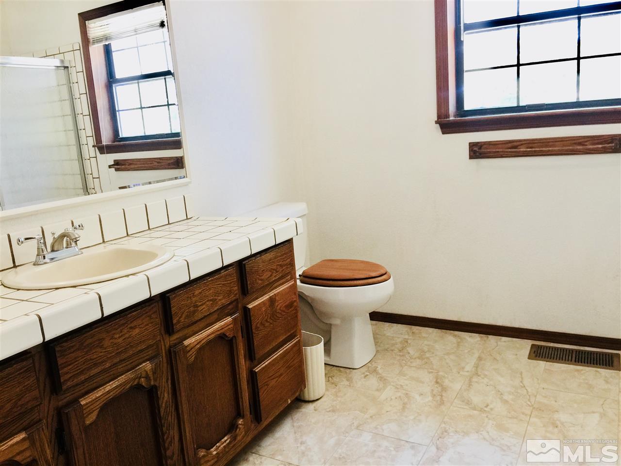 2277 Soda Lake Road Fallon, NV 89406 - Photo 17 of 25 a bathroom with a sink and a toilet