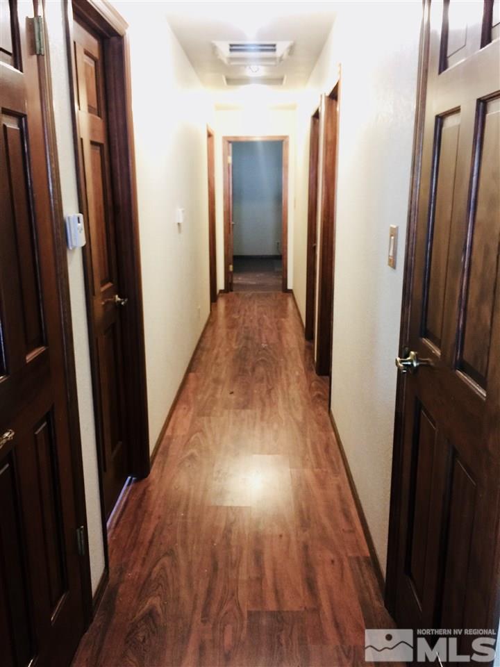 2277 Soda Lake Road Fallon, NV 89406 - Photo 10 of 25 a view of a hallway with wooden floor