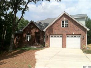 161 Rushing Water Lane Troutman, NC 28166 - Photo 1 of 14 a front view of a house with a yard and garage