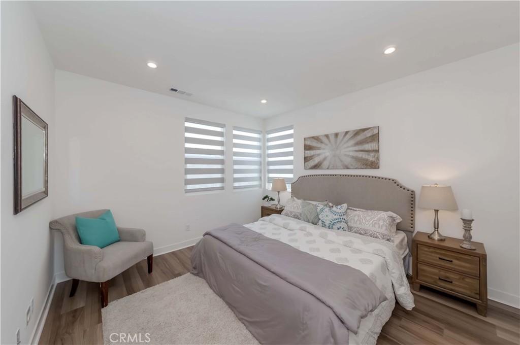 1403 West Bushell Street Anaheim, CA 92805 - Photo 15 of 34 a bedroom with a bed and a couch