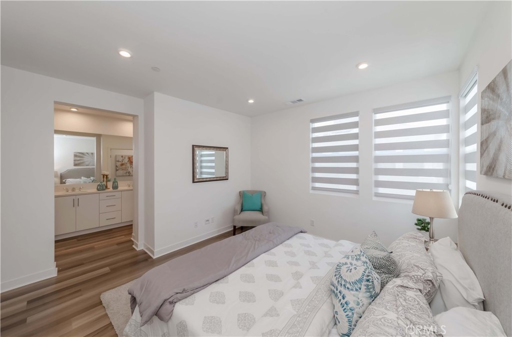 1403 West Bushell Street Anaheim, CA 92805 - Photo 16 of 34 a bedroom with a bed and a large window