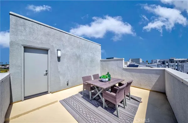 a view of city from balcony with seating space