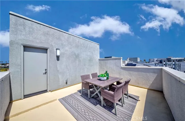 a view of city from balcony with seating space