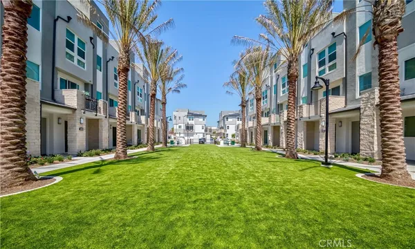 a view of a swimming pool with outdoor seating