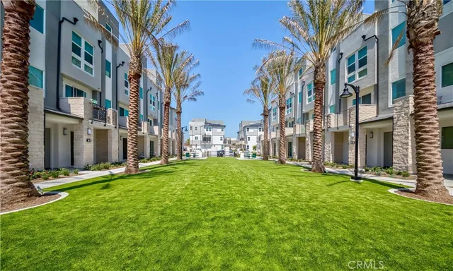 a view of a swimming pool with outdoor seating