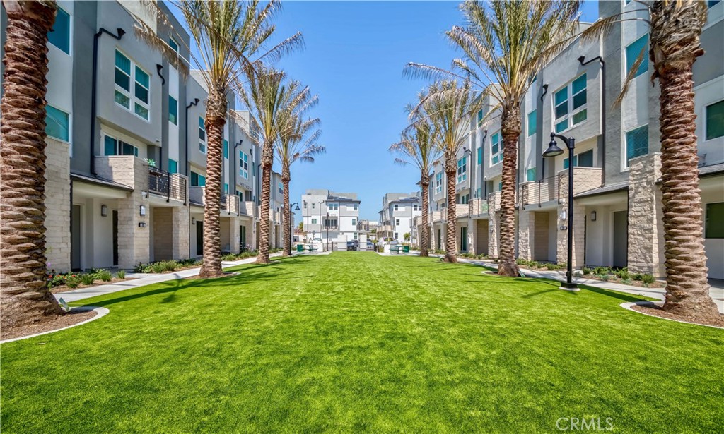 1403 West Bushell Street Anaheim, CA 92805 - Photo 31 of 34 a view of a yard with tall buildings