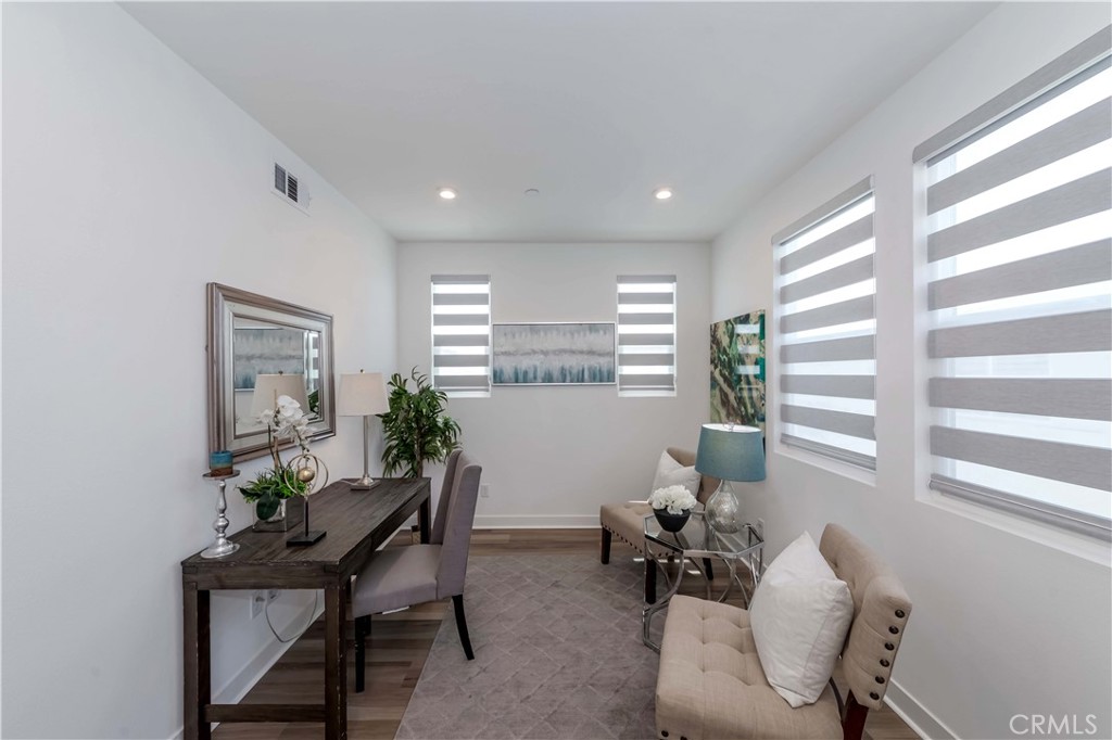 1403 West Bushell Street Anaheim, CA 92805 - Photo 8 of 34 a living room with furniture and a window