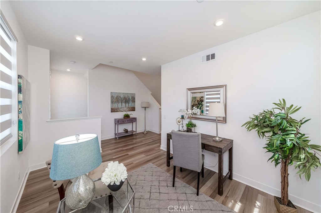 1403 West Bushell Street Anaheim, CA 92805 - Photo 10 of 34 a living room with furniture and a potted plant