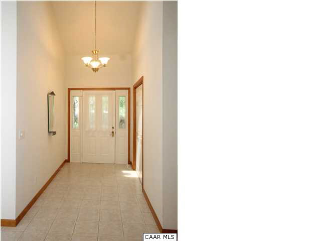 39 Hardwood Road Palmyra, VA 22963 - Photo 4 of 26 Step into a light-filled immaculate home with natural wood trim and true Foyer with large block ceramic tile, sidelights and coat closet.