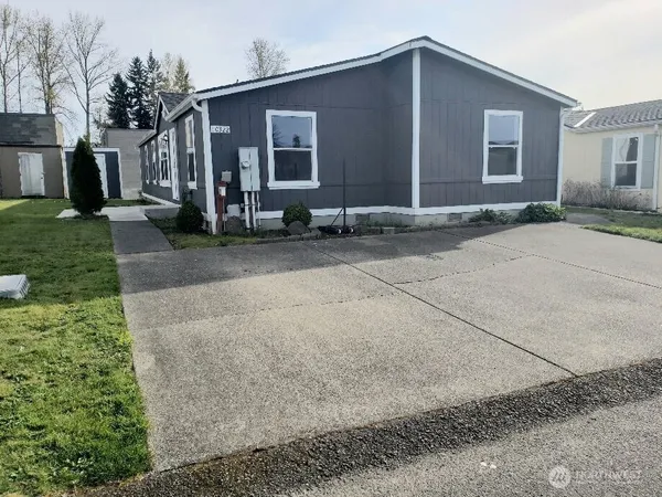 a kitchen with stainless steel appliances granite countertop a refrigerator stove microwave and sink