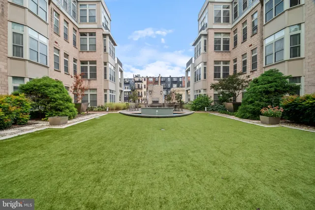 a view of a big yard and front view of a building