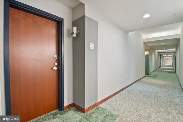 a kitchen with stainless steel appliances a refrigerator sink and microwave