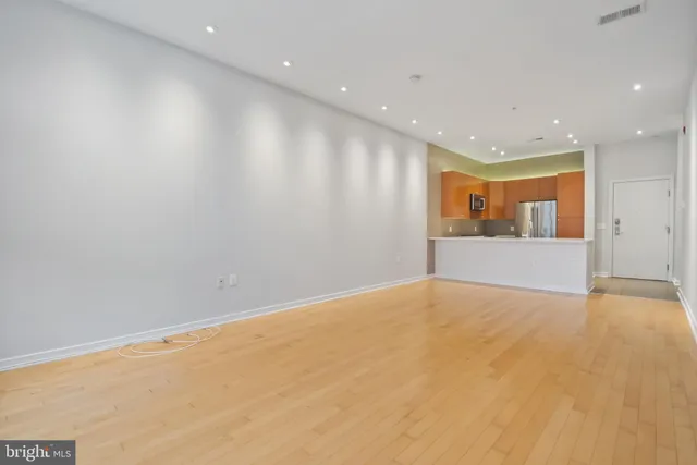 a kitchen with a sink and large window