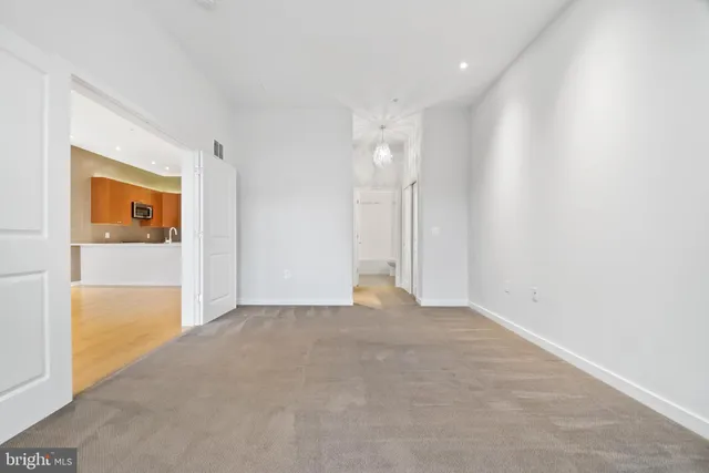 a view of a bathroom from a hallway