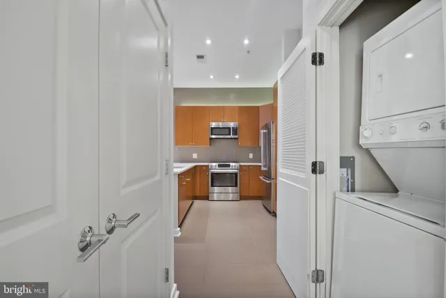 a kitchen with a sink and a refrigerator