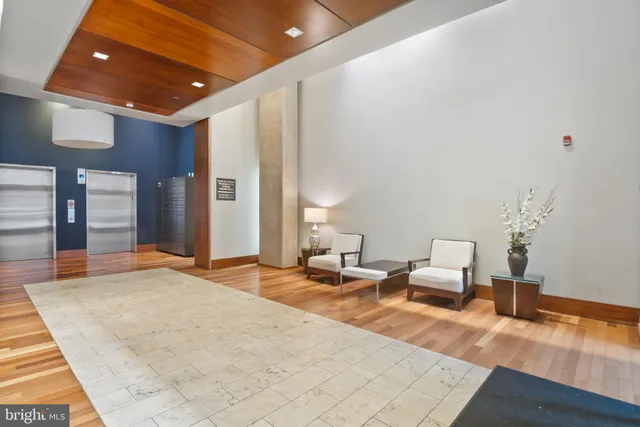 a bedroom with furniture and wooden floor