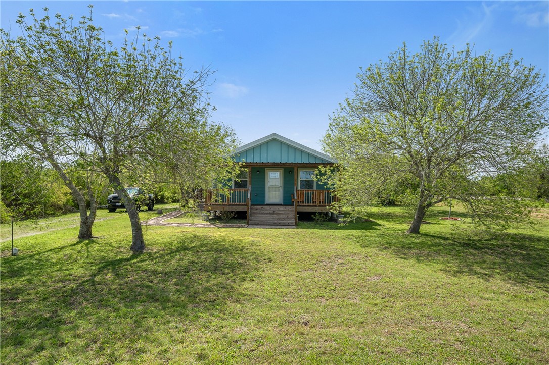 a house with trees in the background