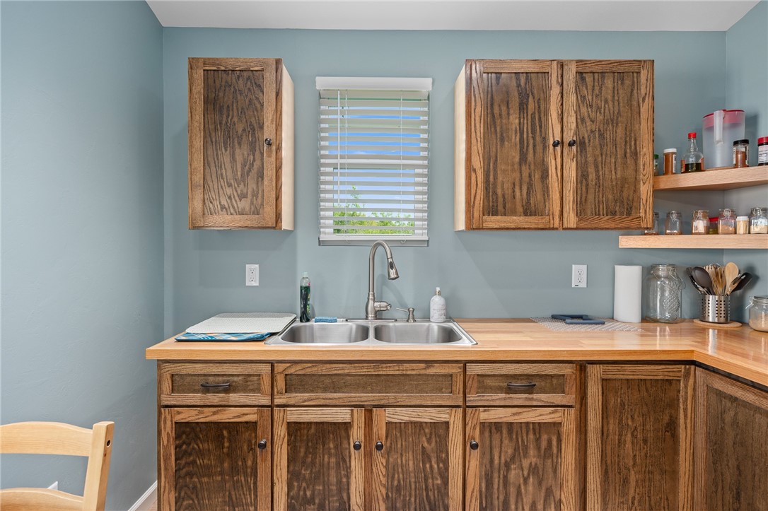 726 3rd Street Bayside, TX 78340 - Photo 11 of 40 a kitchen with a sink cabinets and a window