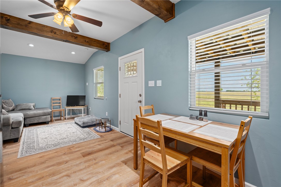 726 3rd Street Bayside, TX 78340 - Photo 12 of 40 a dining room with a wooden table and chairs