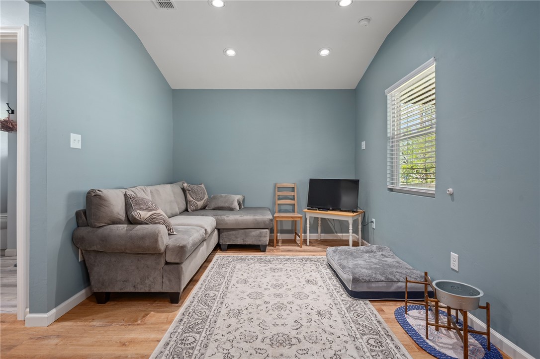 726 3rd Street Bayside, TX 78340 - Photo 13 of 40 a living room with furniture and a flat screen tv