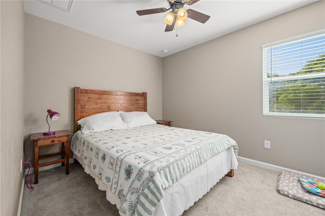 726 3rd Street Bayside, TX 78340 - Photo 19 of 40 a bedroom with a bed and window
