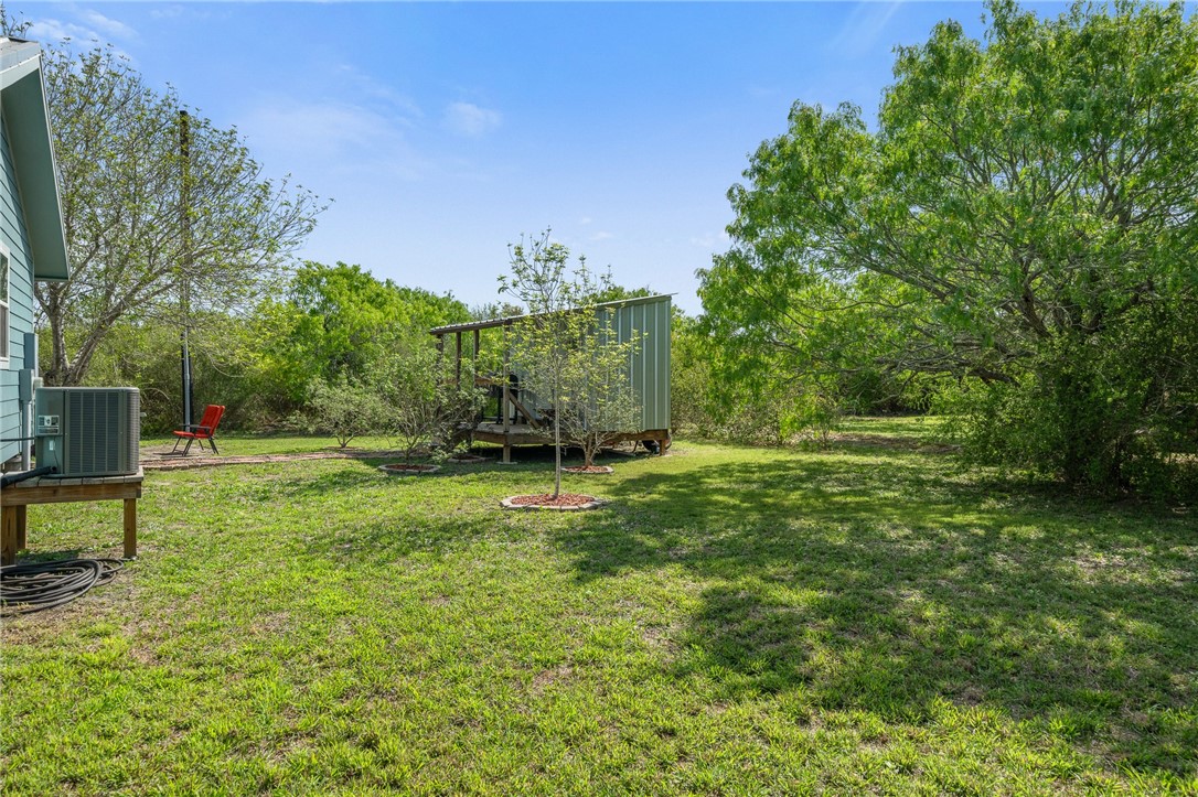 726 3rd Street Bayside, TX 78340 - Photo 23 of 40 a view of a garden with a bench