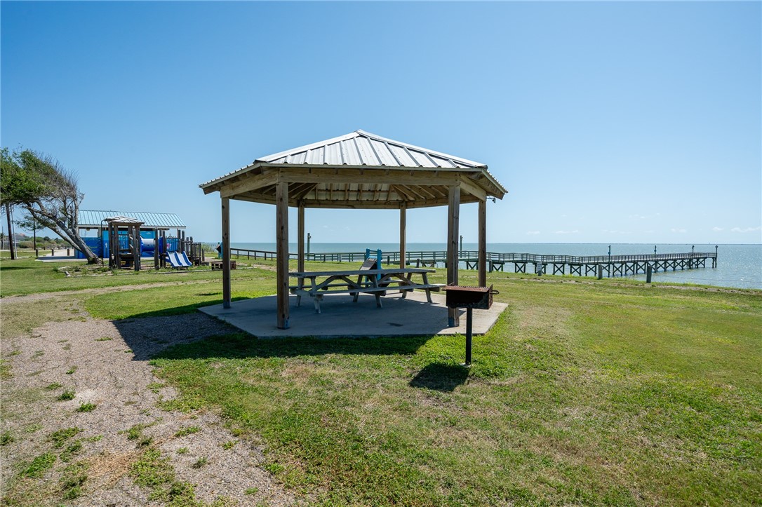 726 3rd Street Bayside, TX 78340 - Photo 26 of 40 a swimming pool with outdoor seating and yard