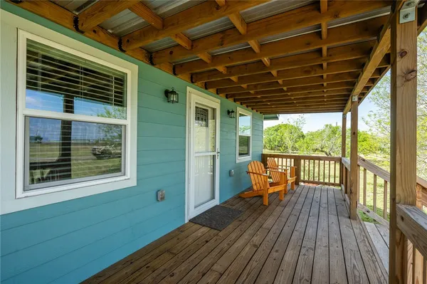 a view of a balcony with wooden floor
