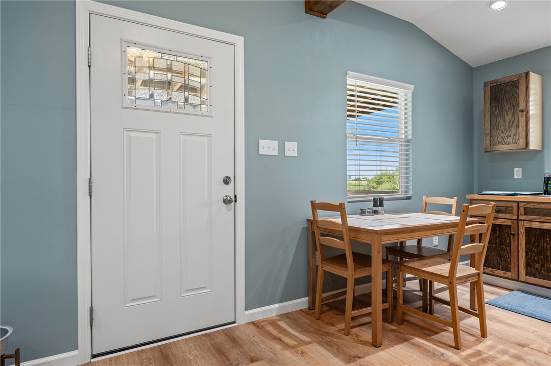 726 3rd Street Bayside, TX 78340 - Photo 8 of 40 a view of a dining room with furniture window and wooden floor