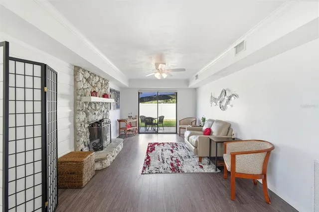 a patio with a table and chairs under an umbrella