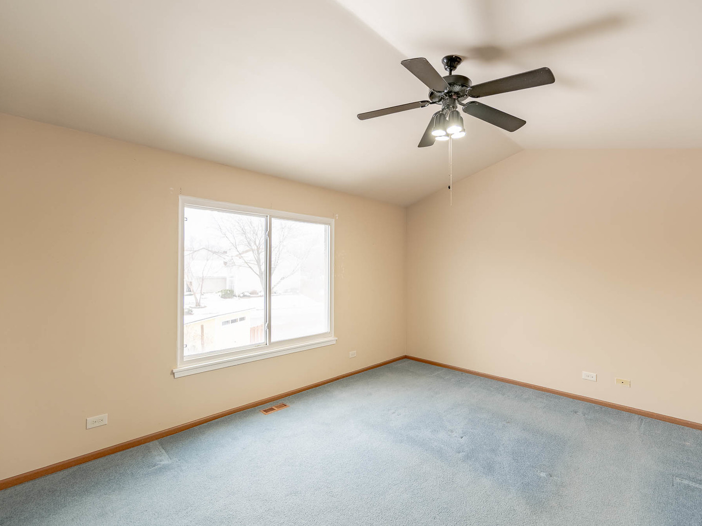 808 Trinity Court Carol Stream, IL 60188 - Photo 9 of 12 an empty room with a window and a fan