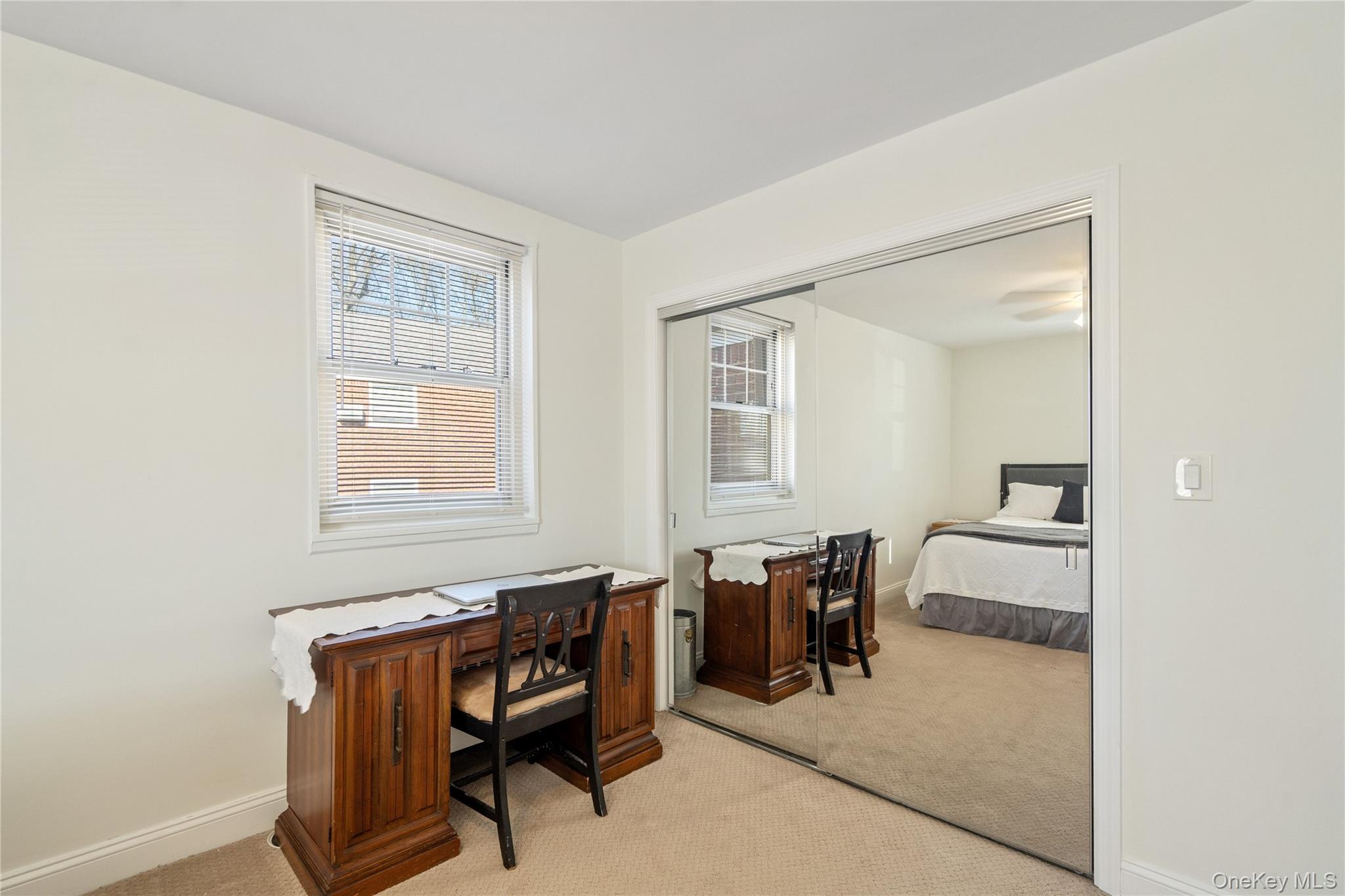 63-09 252nd Street, Unit 41322 Queens, NY 11362 - Photo 19 of 25 a view of a workspace with furniture and a window