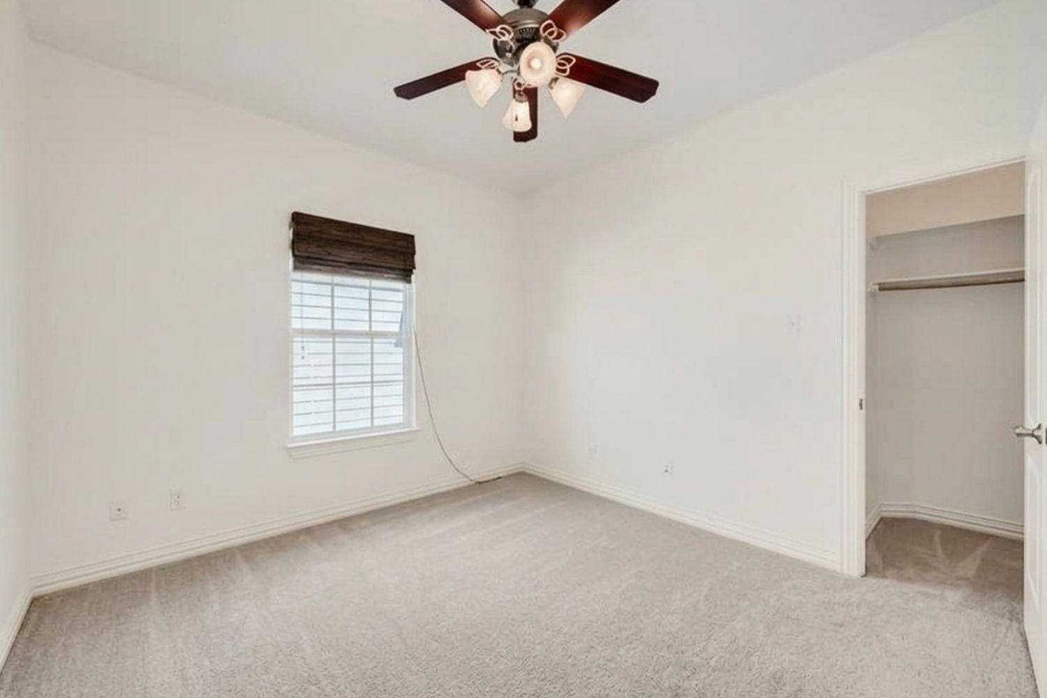 6715 Windrift Way, Unit 28 Austin, TX 78745 - Photo 16 of 19 An airy bedroom with soft carpeting and a ceiling fan awaits your personal touch.